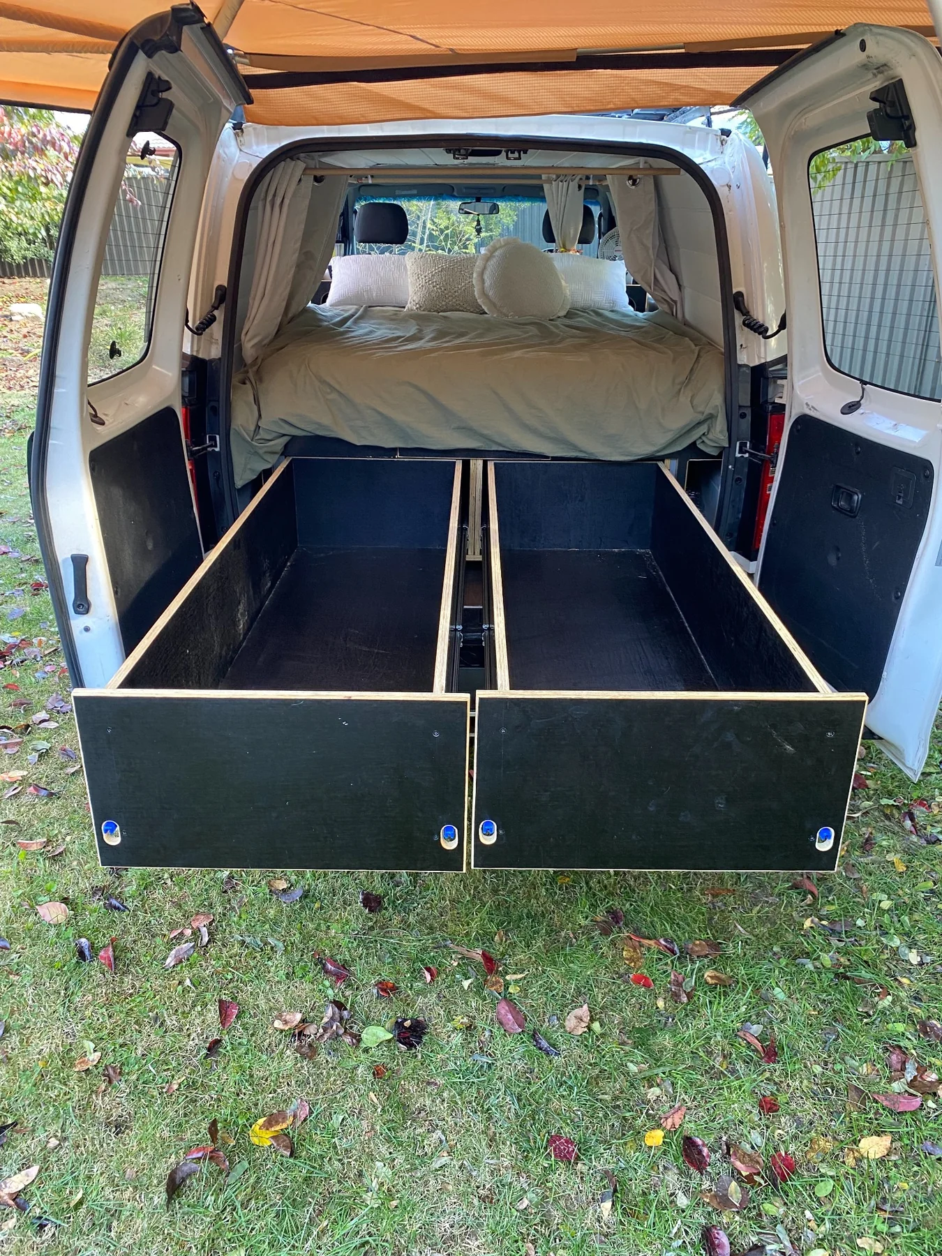 Full length pull-out storage drawers in camper van