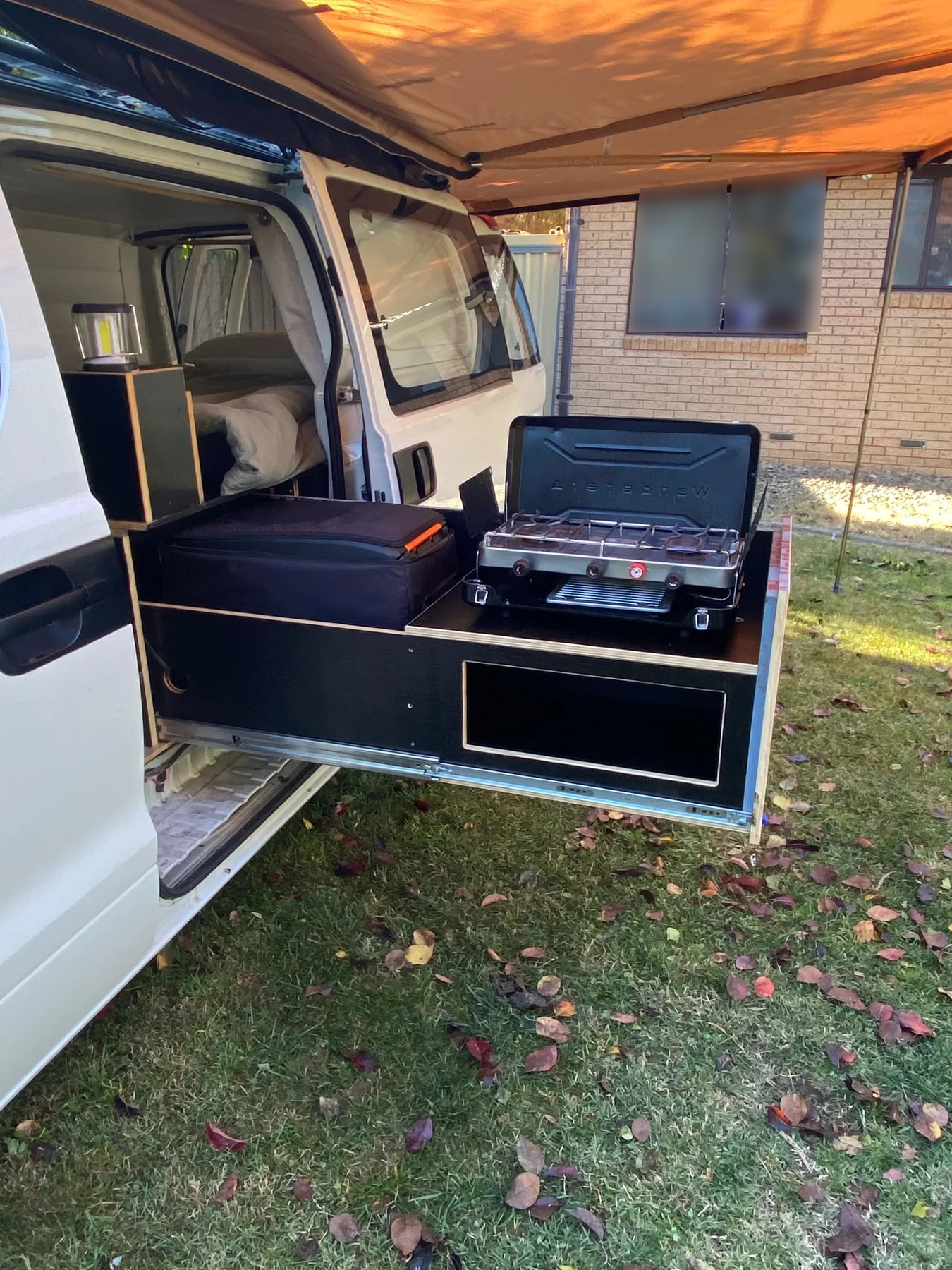Previous Hush Supply camper van conversion with slide-out kitchen